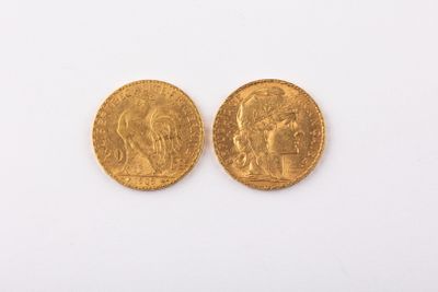 two gold sovereigns, one of which has a head of a man and the other of a woman
