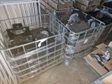 a large metal basket filled with electronics in a room