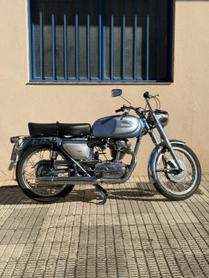 a motorcycle that is parked in front of a building