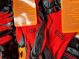 a pile of gloves with tags on them in a store
