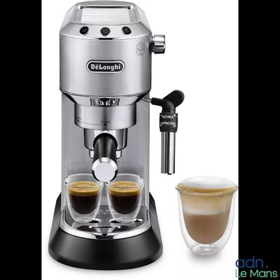 a close up of a coffee machine with two cups of coffee