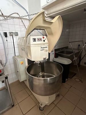 an image of a commercial mixer in a kitchen