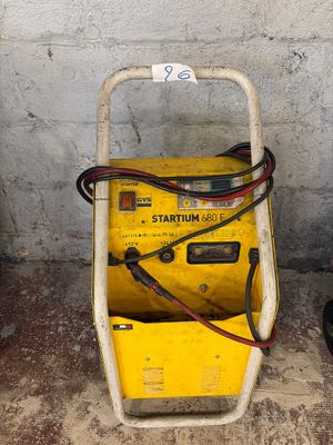 a small yellow machine that is sitting on the ground