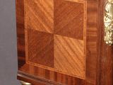 a small wooden table with a drawer on it