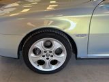 a picture of a silver car parked in a garage
