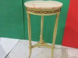 a small table that has a marble top on it
