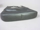grey leather purse with chain strap on white surface