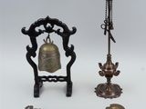 three different types of bells and spoons on a white surface