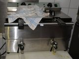 a towel on the top of a machine in a kitchen