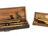 two different types of instruments in a wooden case