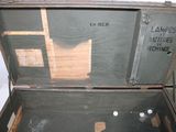 an old trunk with a lot of things inside of it