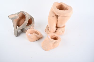 three clay sculptures that are sitting next to each other