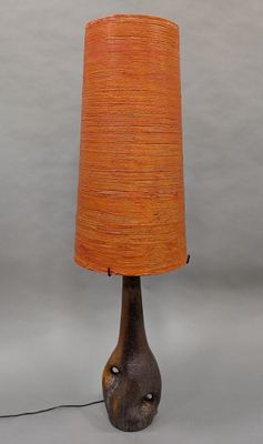pair of mid - century modern table lamps with orange shades