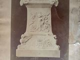 an old picture of a vase on the wall