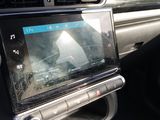 a picture of a car dashboard with a digital device in it