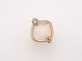 an image of a gold ring with a white stone and a diamond