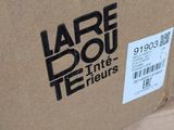a box with a label on it sitting on the floor