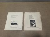 two books sitting on a table with pictures on them