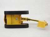 a small yellow machine that is sitting on a white surface