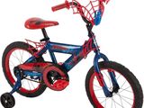 the spider - man bike is blue and red with a spider - man helmet
