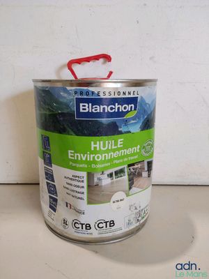 a can of paint that is sitting on a table