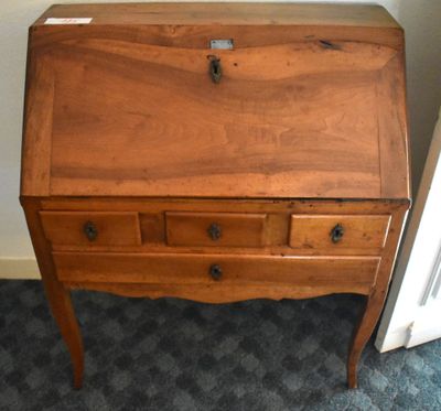a small wooden desk with a drawer on top of it