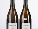 deux bouteilles de vin posées l'une à côté de l'autre sur une surface blanche