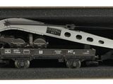 a box with a toy train and a truck in it