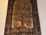 an image of a tapestry hanging on a wall with a tree of life on it