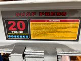 a sign on the side of a machine that says shop press