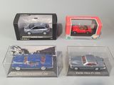 three boxed toy cars are sitting on a table next to each other