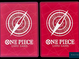 two red playing cards with one piece and one piece on them
