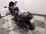 a motorcycle that is parked on a checkered floor