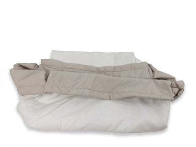 REDOO - Ce réducteur de lit bicolore beige et blanc accueill…