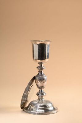 silver plated chalicet on a beige background