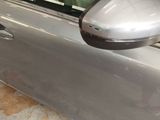a close up of a car door with a mirror on it