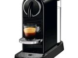 an image of a black coffee machine with a cup of coffee