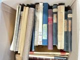 a box full of books that are sitting on a table