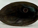 an image of a bronze sink on a white surface