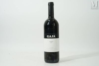 a bottle of wine that is sitting on a table