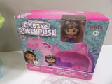 a box with a doll in it sitting on a table