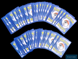 a lot of pokemon cards sitting on top of each other