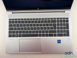 an open laptop computer sitting on top of a white table