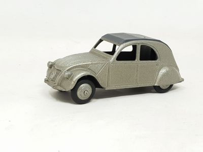 a toy car that is sitting on a white surface