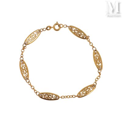 a gold plated bracelet with oval links and leaves