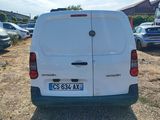 a white van that is parked in a lot