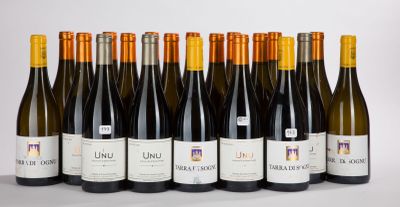 six bottles of wine are lined up in a row on a table