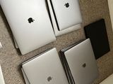four laptops sitting on the floor next to each other