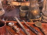 a table with a lot of antique items on it