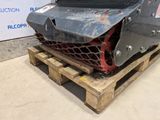 an image of a fork attachment on a pallet in front of a construction sign